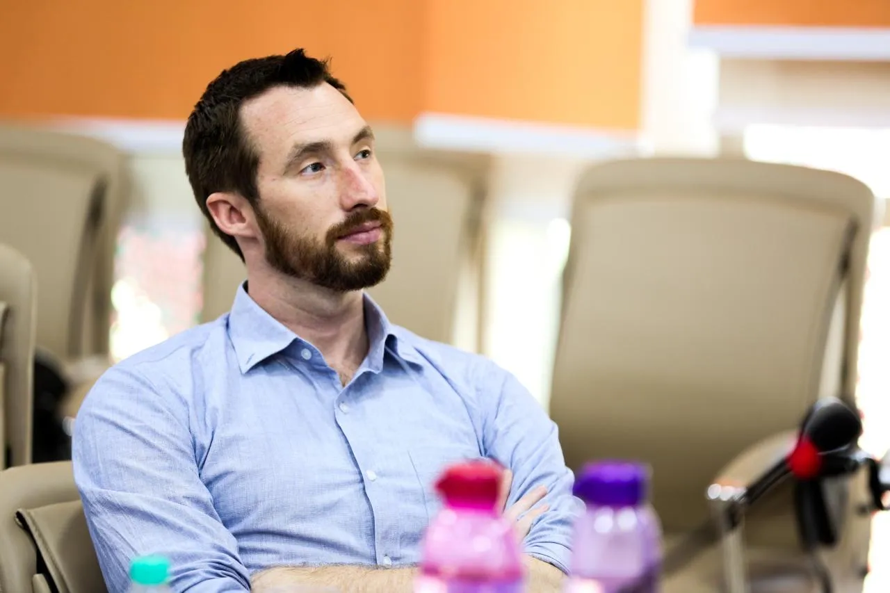 Jeremy listening to the Tibetan entrepreneurs' pitches.